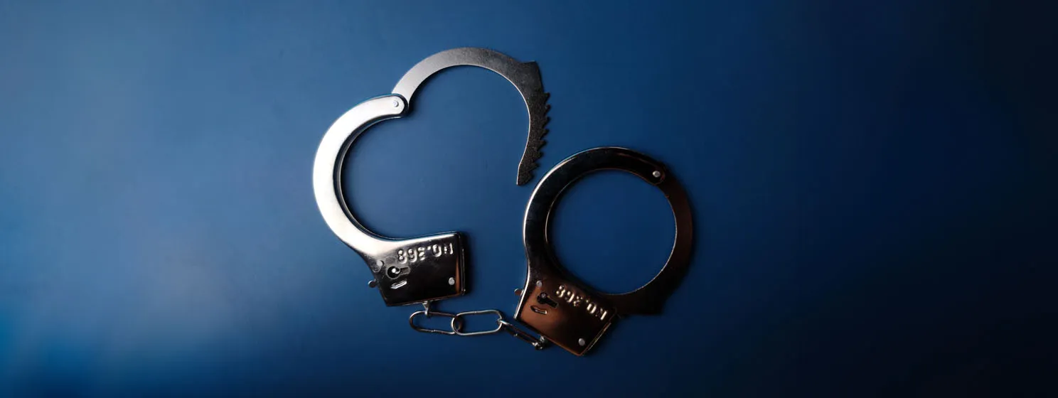op view handcuffs on a blue background