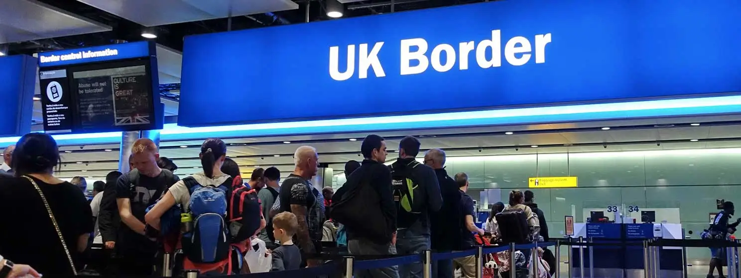 People in the airport UK border