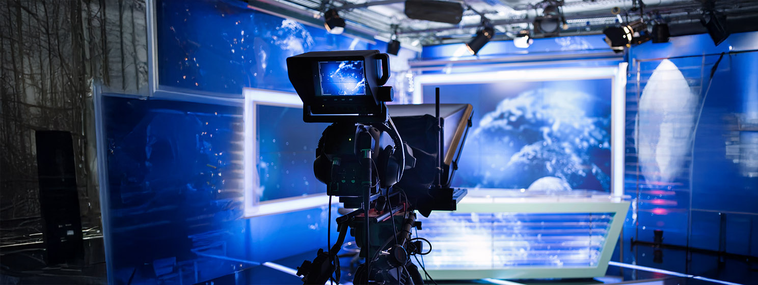 Video camera recording show in TV studio.