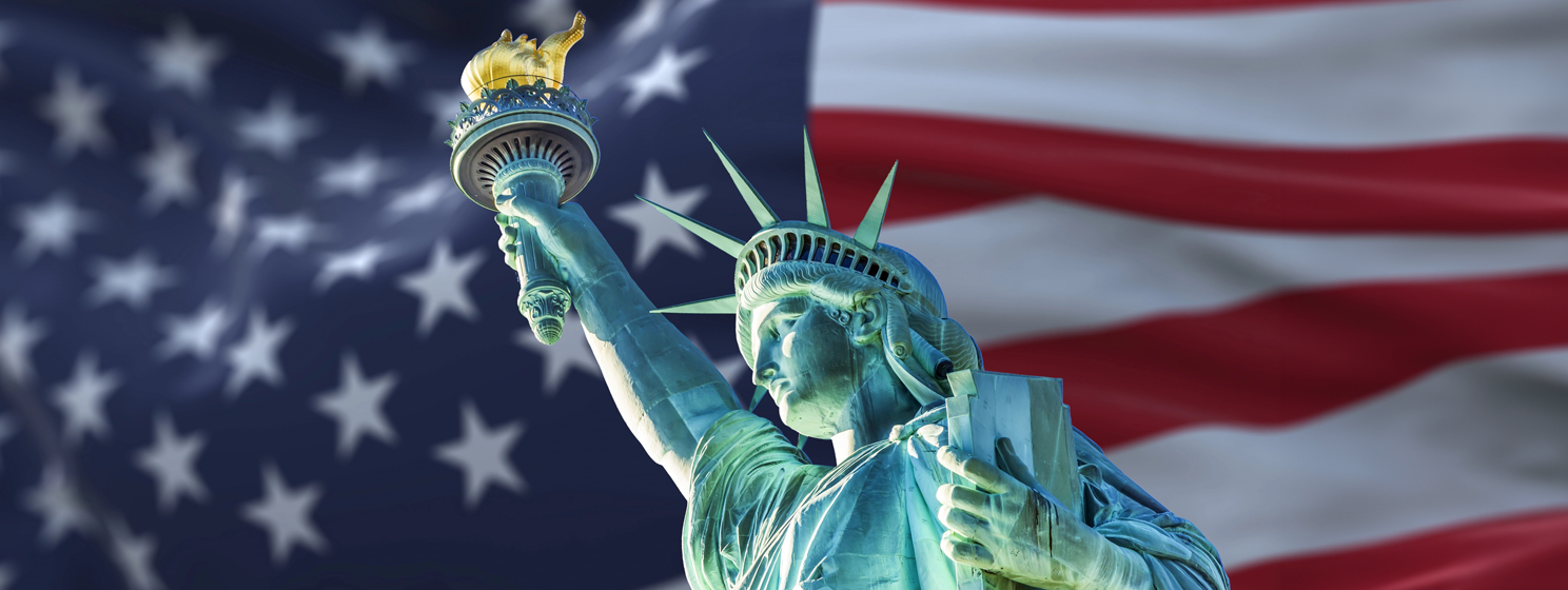 statue of liberty over us flag