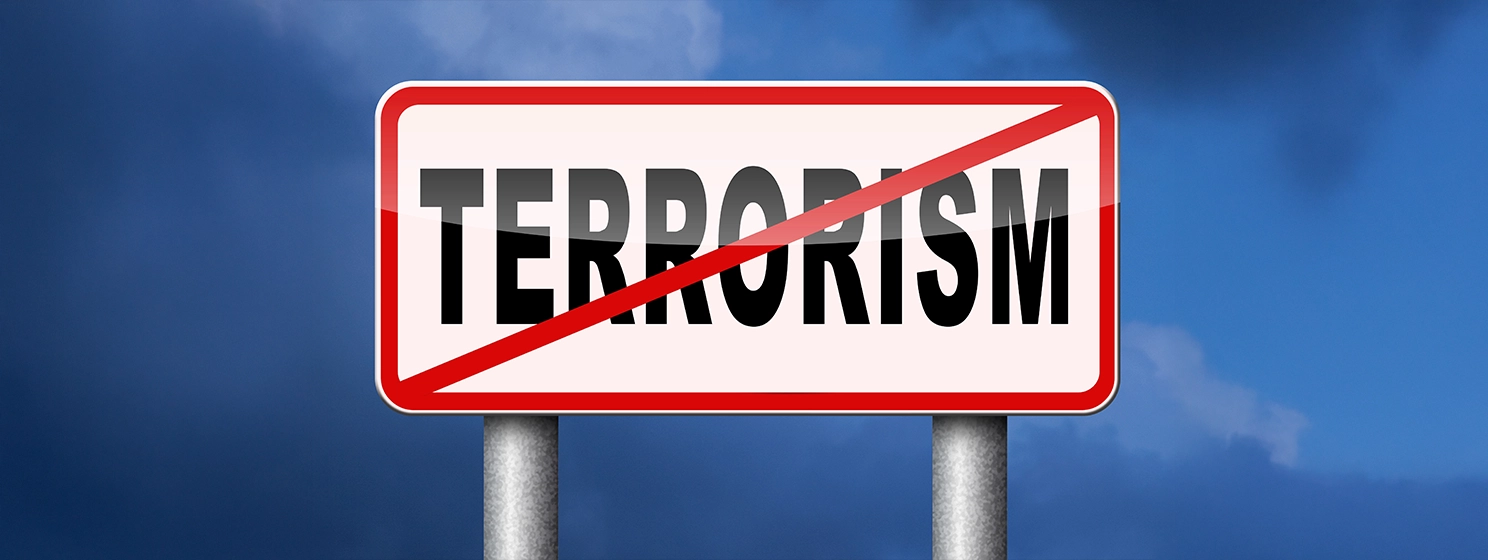 Terrorism text on a sign board with a red line, signifying stopping terrorism.