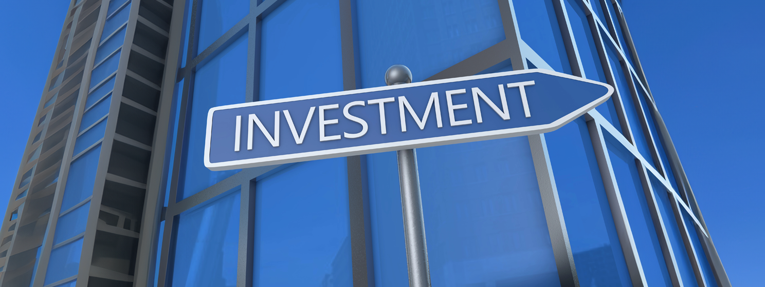 Investment signage in front of a building