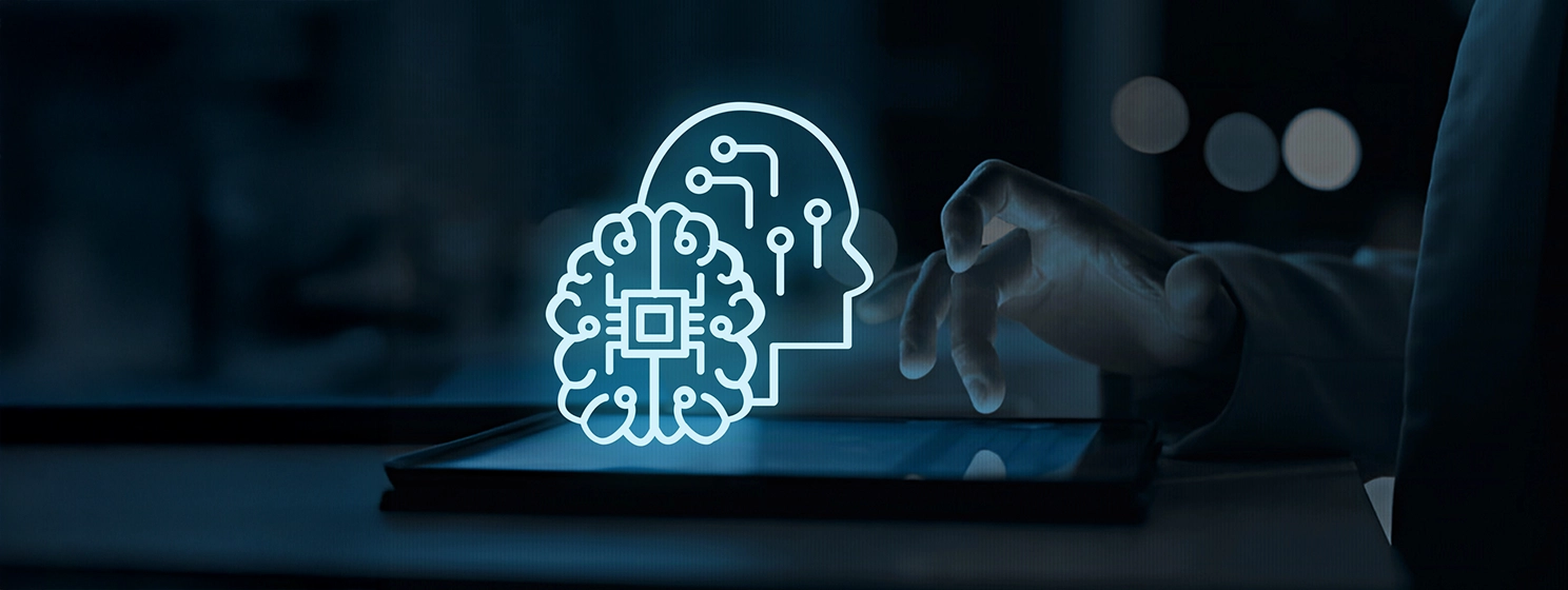 Icon symbolizing AI. Behind it a man using a tablet on a table.