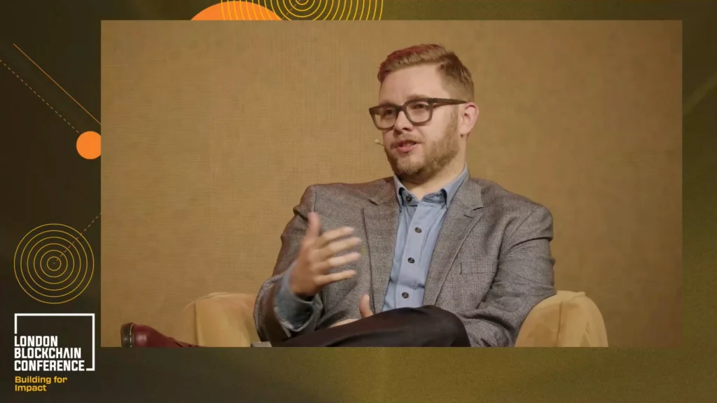 TrillTech Product Lead Ben Elvidge at the London Blockchain Conference 2025 stage.