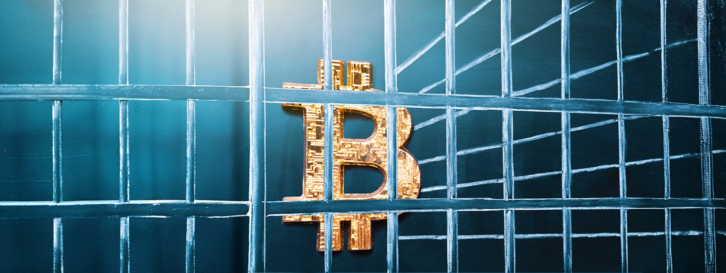 Bitcoin in prison. Concept of arrest.