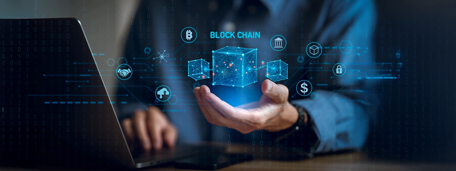 Businessman using a computer and blockchain icon in hand to Blockchain technology concept with a chain of encrypted blocks to secure cryptocurrencies and bitcoin for online payments.