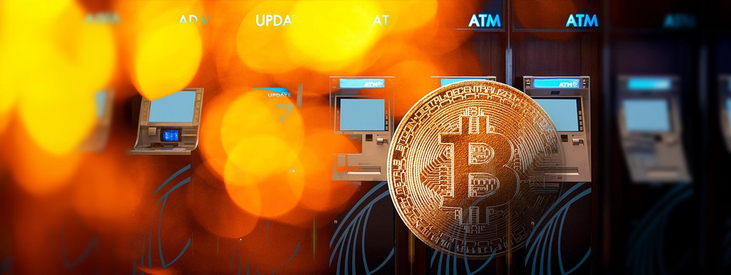 Golden bitcoin coin symbol of bitcoin crytocurrency with multiple ATM machine at the back.