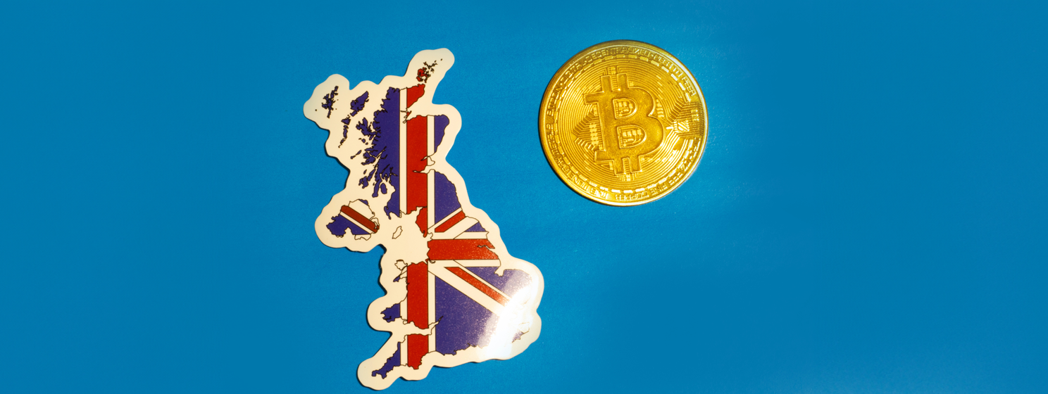 UK Flag with Bitcoin flat lay for illustration