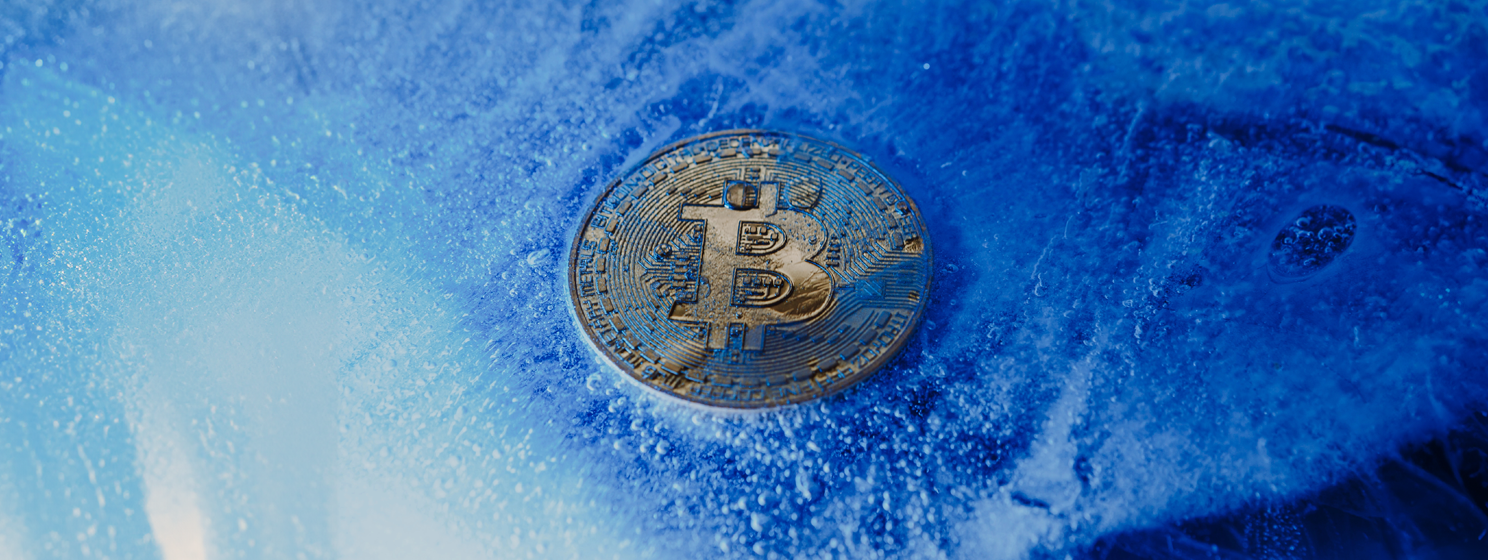 Golden symbol bitcoin frozen and covered with ice banner