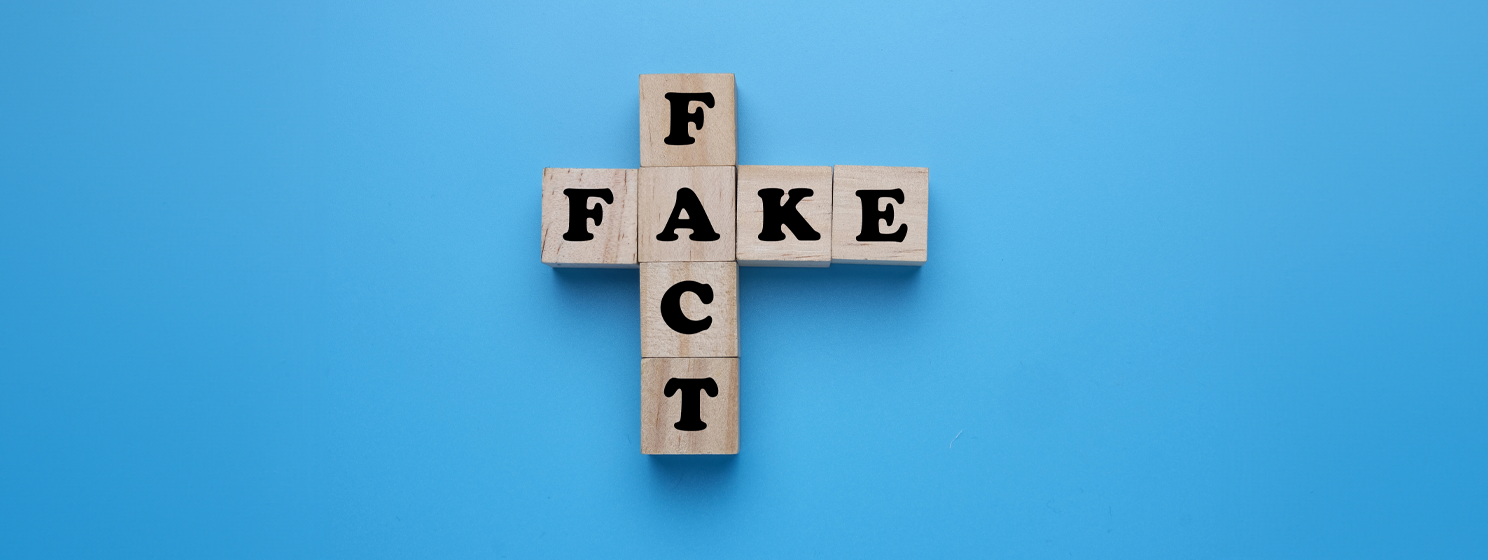 A picture of wooden block written fake fact for education concept - deepfakes